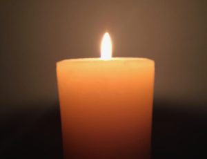 vigil candle burning with warm glow