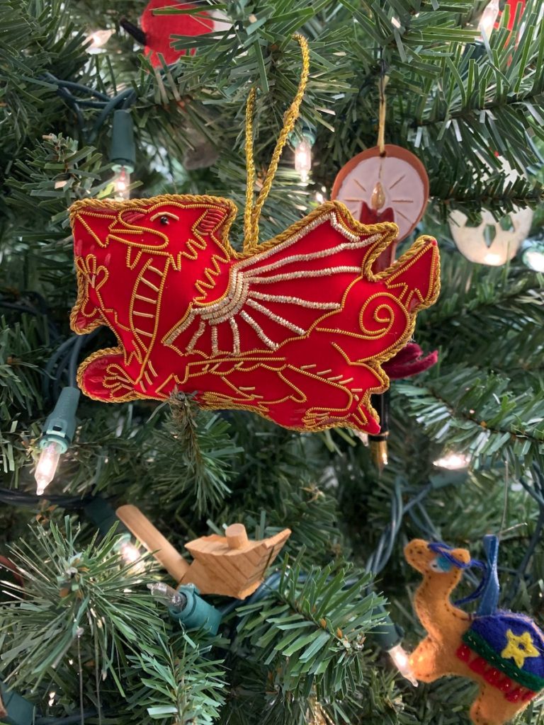 Red dragon and other Christmas ornaments on the tree