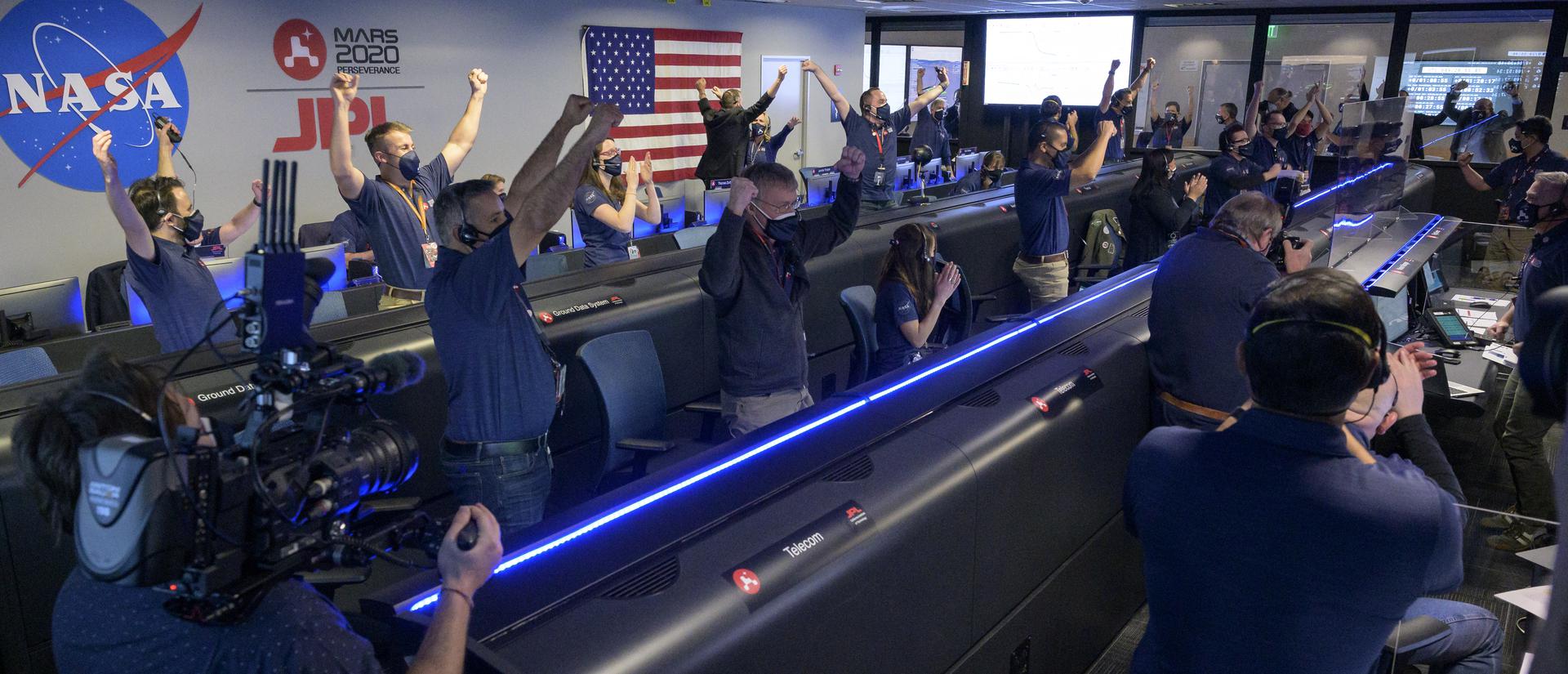 NASA photo of Mars 2020 Perseverance Rover team in Mission Control, cheering when they heard the news that Perseverance had landed safely on Mars.